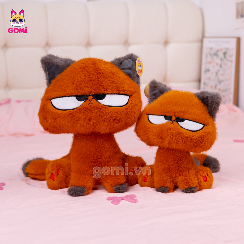 Gấu Bông Mèo Cam Mắt Liếc