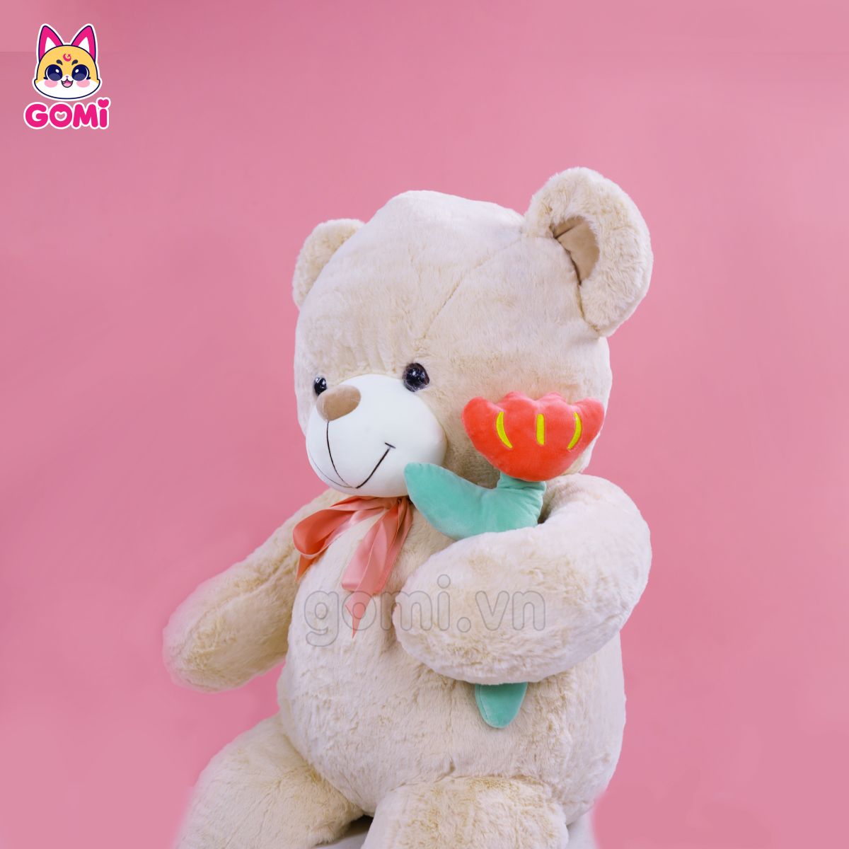 Gấu Bông Teddy Nơ Cầm Hoa Trắng