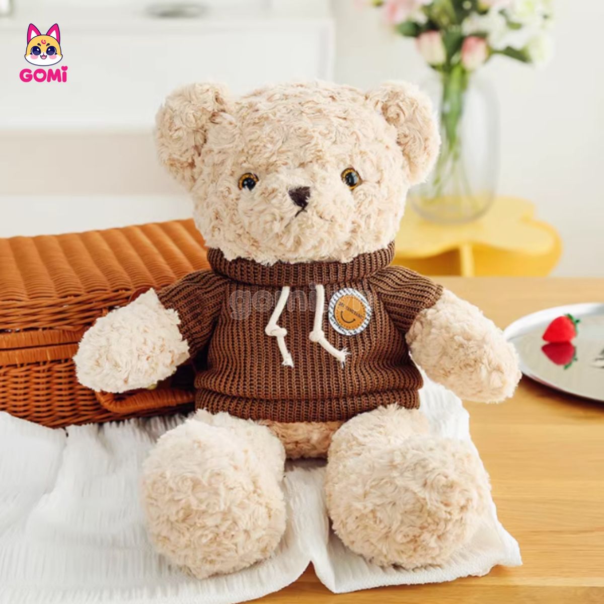 Gấu Bông Teddy Lông Xoắn Áo Logo Da